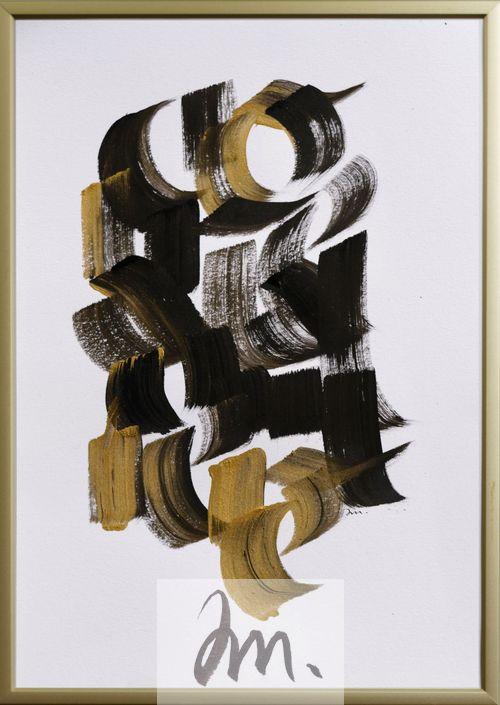 Calligraphie noire et or sur papier blanc. On devine des lettres mais pas les mots