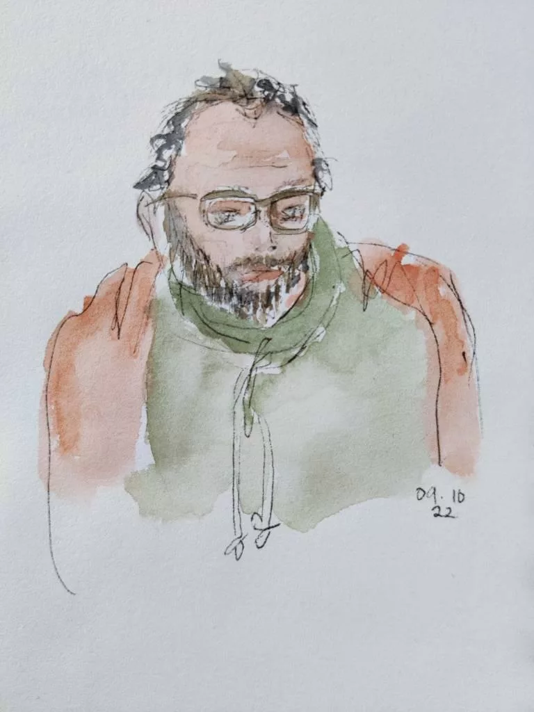 Croquis au feutre et aquarelle d'un homme avec des lunette (et un plaid parce qu'il avait froid !) ; "09.10.22"