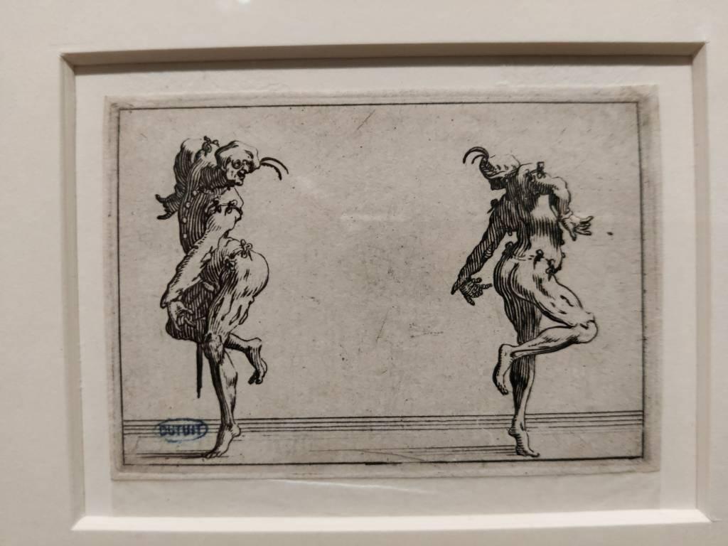 Dessin noir de deux personnages caricaturaux dansant