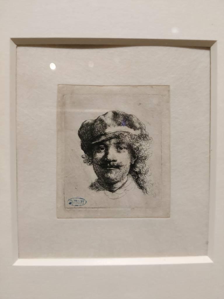 Dessin au trait noir sur papier blanc dans un encadrement blanc