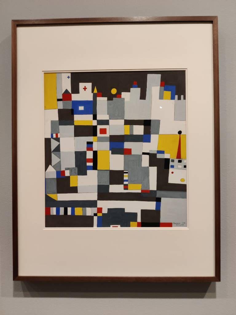 Représenation qu'on pourrait croire abstraite mais où on peut aussi deviner une ville composée de formes géométriques (majoritairement des rectangles) noirs, blancs, jaunes, rouges et bleus