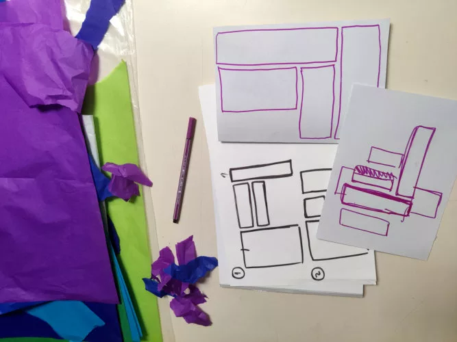 Des feuilles avec des schémas, des feuilles de couleurs, un stylo
