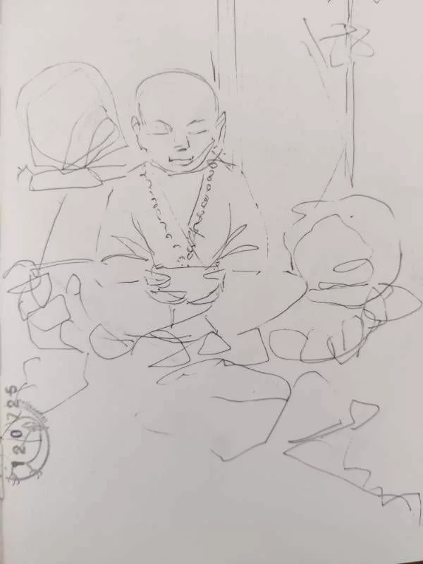 Dessin au feutre fin d'un moine méditant (en vrai, une sculpture dans des cailloux)