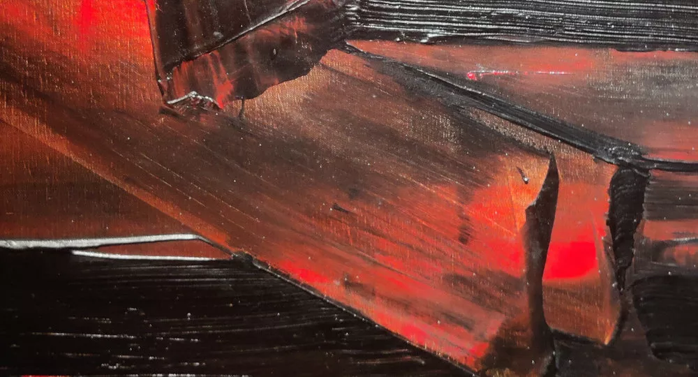Détail d'une peinture faite de traces noires et rouges